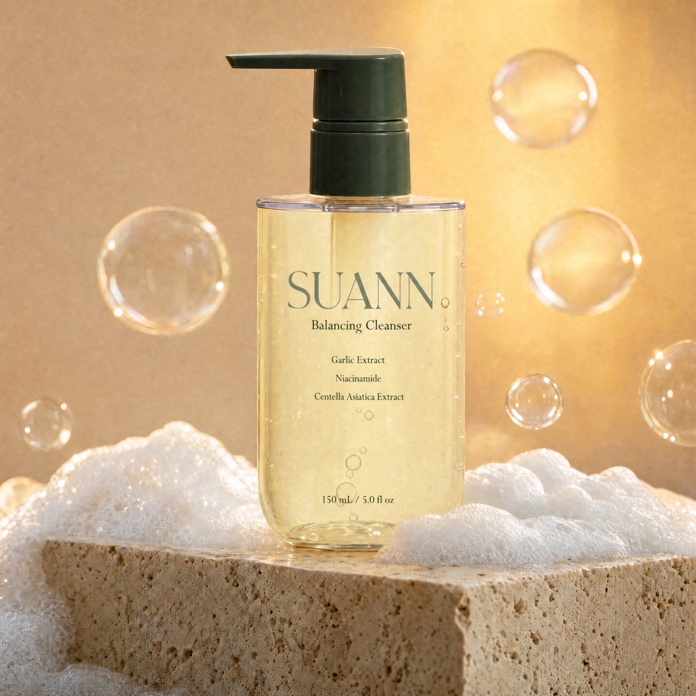 SUANN Balancing Cleanser pump bottle on a stone block